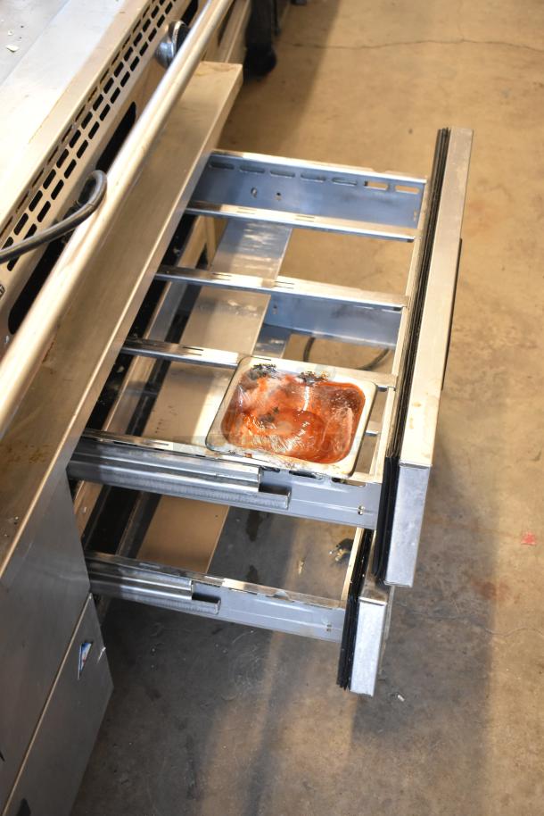 American Range commercial countertop flat top griddle on a 4-drawer chef base in used condition.