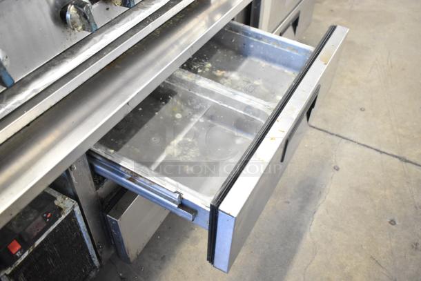 Radiance commercial gas range with 6 burners on Everest 4-drawer chef base. Visible wear, stainless steel surfaces.