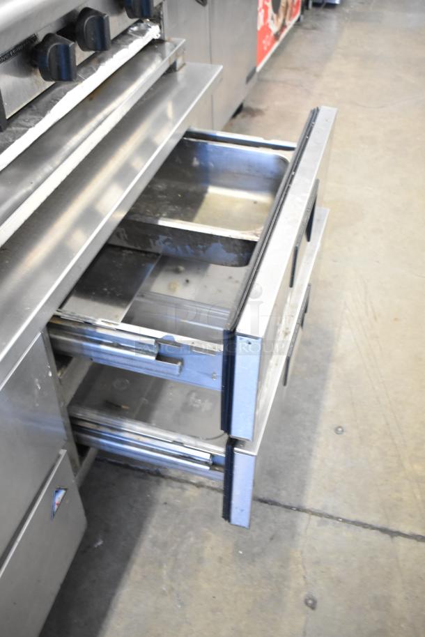 Radiance 6 burner gas range with Everest 4 drawer chef base. Stainless steel, used condition, ideal for commercial kitchens.