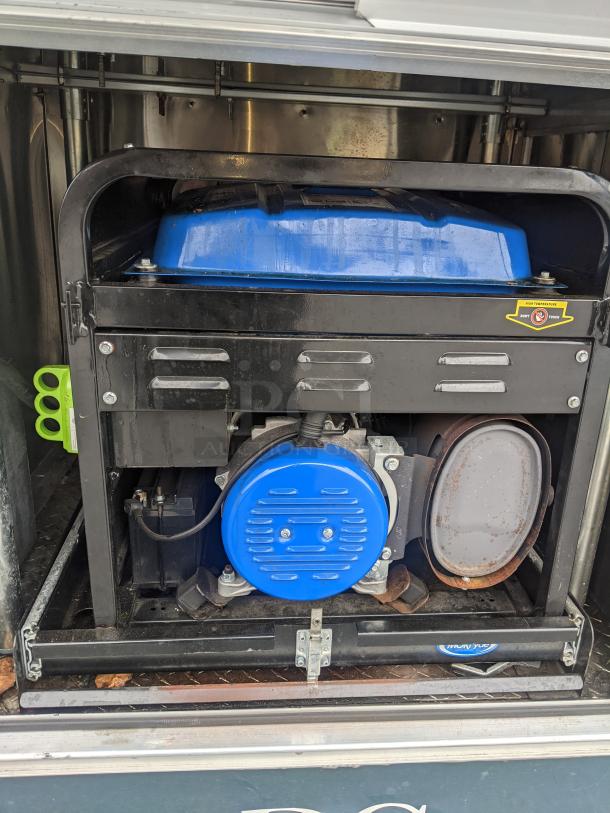 2002 Freightliner MT45 food truck generator compartment, featuring blue and black components with visible rust and wear.