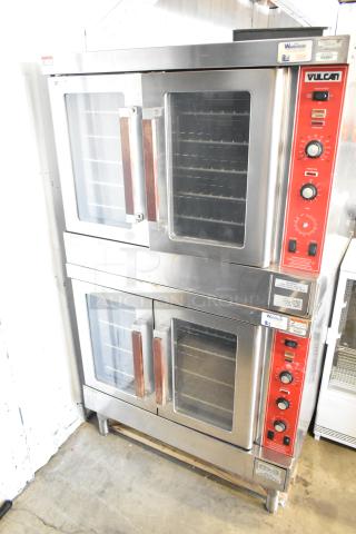 2 Vulcan SG4D Commercial Convection Ovens, gas-powered, view-through doors, thermostatic controls, stainless steel finish.
