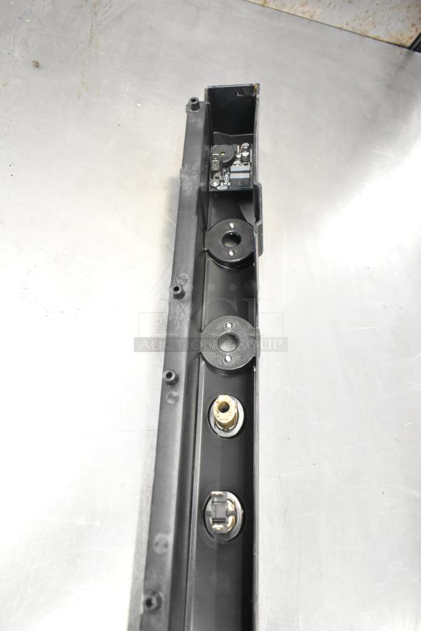 Brand new Cadco/Unox components including ballasts and blower wheel in original condition, shown on metallic surface.