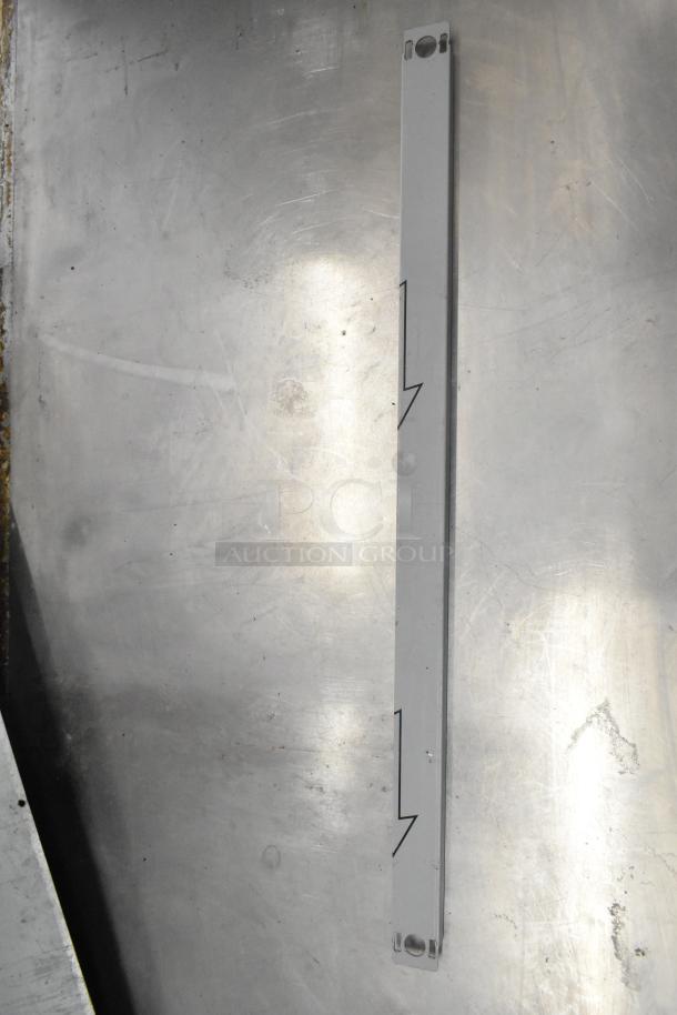 Brand new Cadco/Unox item, possibly a metal strip with hole fittings, part of a lot including ballasts and blower wheel.