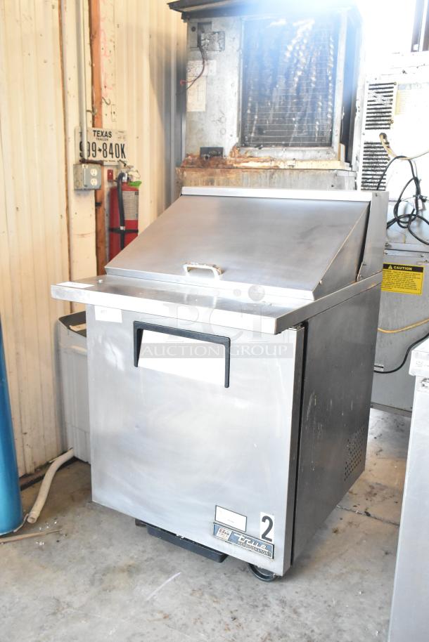 True TSSU-27-12M-B commercial sandwich prep table; stainless steel, mega top, on casters. 115V, 1 phase. Good condition.