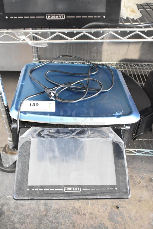 2024 Hobart HTi-7LH4W commercial scale, black, electric cord visible, labeled, does not power on, auction tag 159.