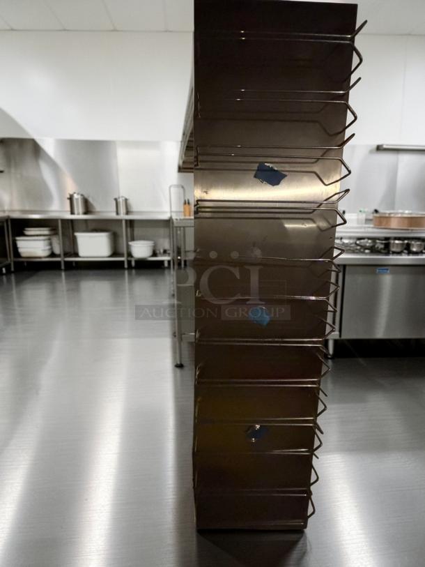 Commercial stainless steel wall-mounted tray rack, 5.6 ft, multi-slot design, model DSP-S-STAND-0660, excellent condition.
