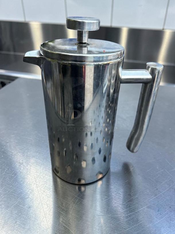 Stainless steel French press coffee maker by Commercial Café Equipment, pristine condition, model CAF-S-PRS-0669.