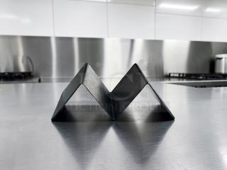 Stainless steel taco holder in prime condition, ideal for commercial use. Model TAC-S-HLD-0672, set of 35.