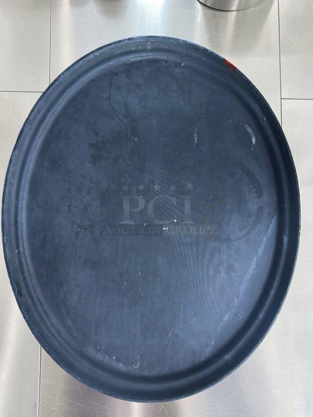 Set of 12 heavy-duty, non-slip round serving trays in superior condition by Commercial Restaurant Equipment. Model SRV-S-TRY-0673.