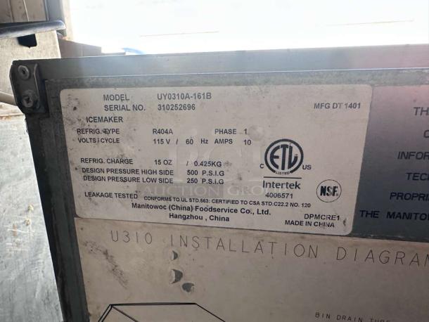 Close-up of Manitowoc UY0310A-161B Ice Maker label, showing model, serial number, voltage, refrigerant type, and certification marks.