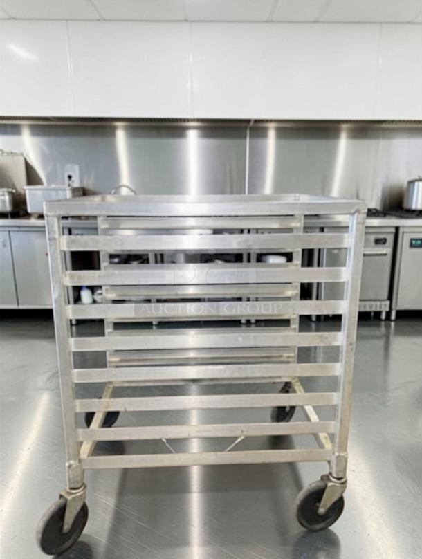 Outstanding condition aluminum 10-tier sheet pan rack cart, model COM-S-RACK-0682, with heavy-duty wheels for mobile kitchen storage.