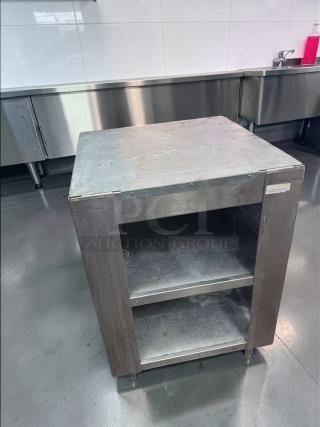 Commercial stainless steel equipment stand, excellent condition, with open shelf storage, for heavy-duty kitchen use.