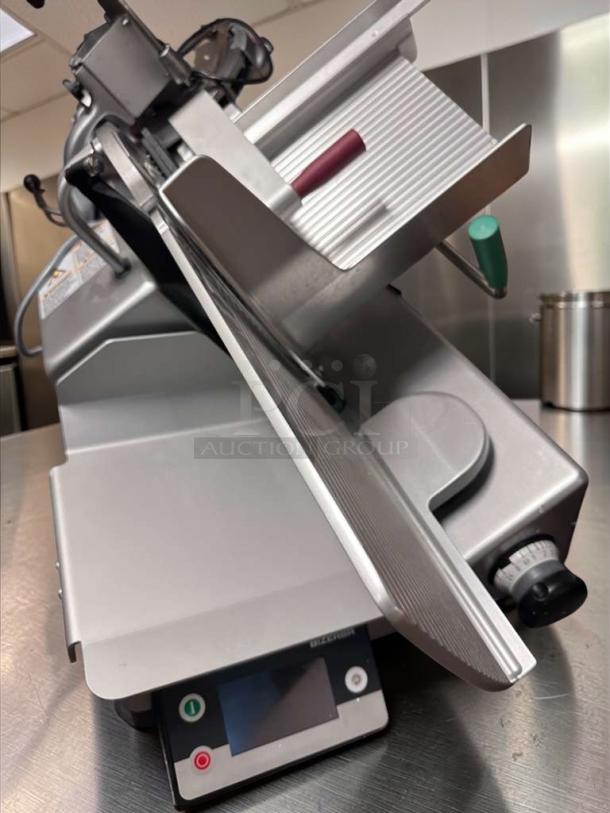 Bizerba GSP HD W-90 deli meat slicer in outstanding condition, 13" blade, integrated portion scale, fully tested, 120V.
