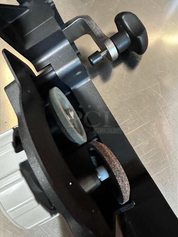 Bizerba GSP HD W-90 slicer sharpening assembly, indicating heavy-duty commercial functionality, in excellent condition.