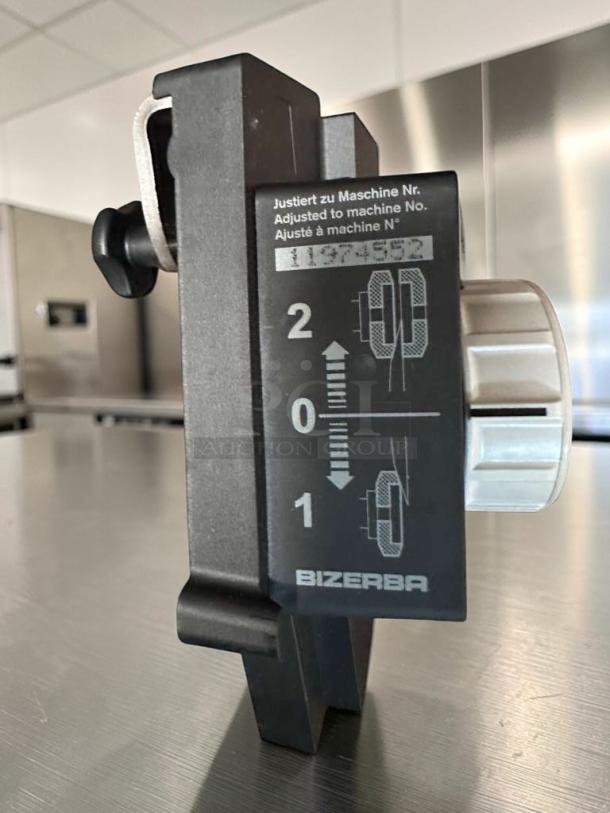 Bizerba GSP HD W-90 deli slicer knob, showing adjustment settings and Bizerba logo, in excellent condition.