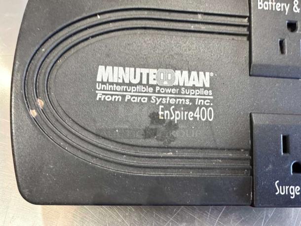 Minuteman EnSpire 400 UPS Battery Backup & Surge Protector, 6 outlets, minor surface wear visible, labeled by Para Systems Inc.