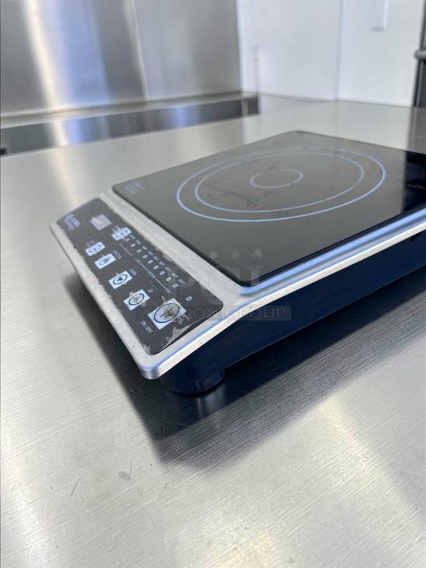 Global Solutions GS1561 commercial induction cooker, 1800W, NSF certified, in outstanding condition with control panel and markings.