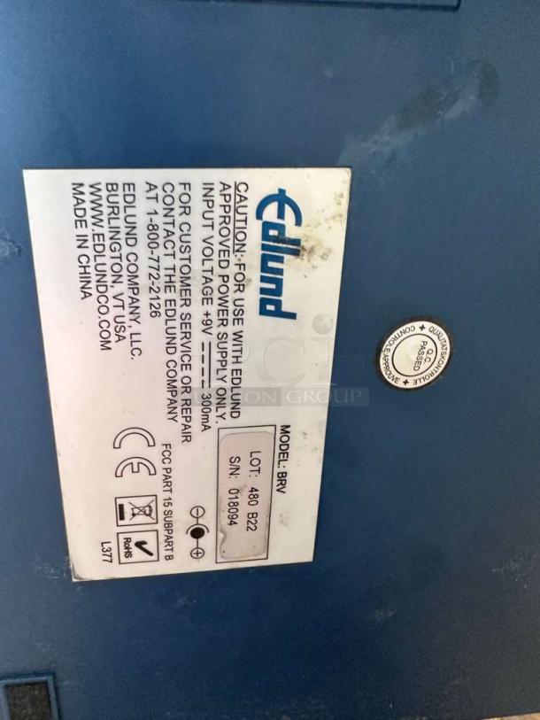 Edlund BRAVO BRV-480 digital portion scale label showing model, serial number, and NSF certification.