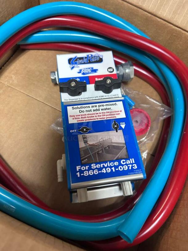 Brand new SinkRite SSDC 3-Compartment Sink Dispenser with red and blue hoses, NSF certified, pre-mix instructions visible.