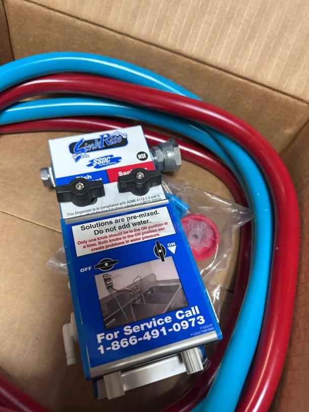 Brand new SinkRite SSDC 3-Compartment Sink Dispenser, NSF certified, for dish detergent and sanitizer, includes blue and red hoses.