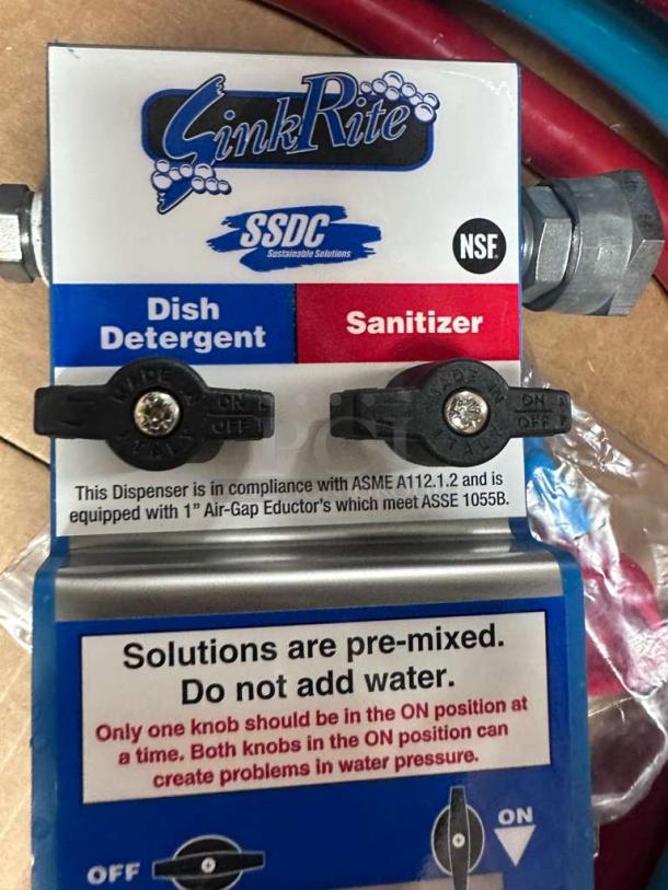 Brand new SinkRite SSDC 3-Compartment Sink Dispenser, NSF certified, for dish detergent and sanitizer, compliance labels visible.