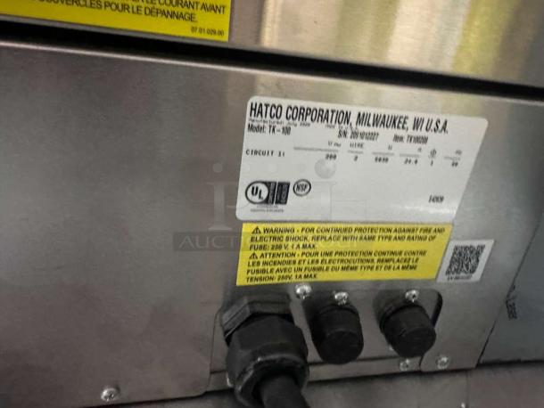 Brand new Hatco Toast-King TK-100 commercial toaster, 1 1/4" capacity, 240V, NSF & UL listed, model tag visible.