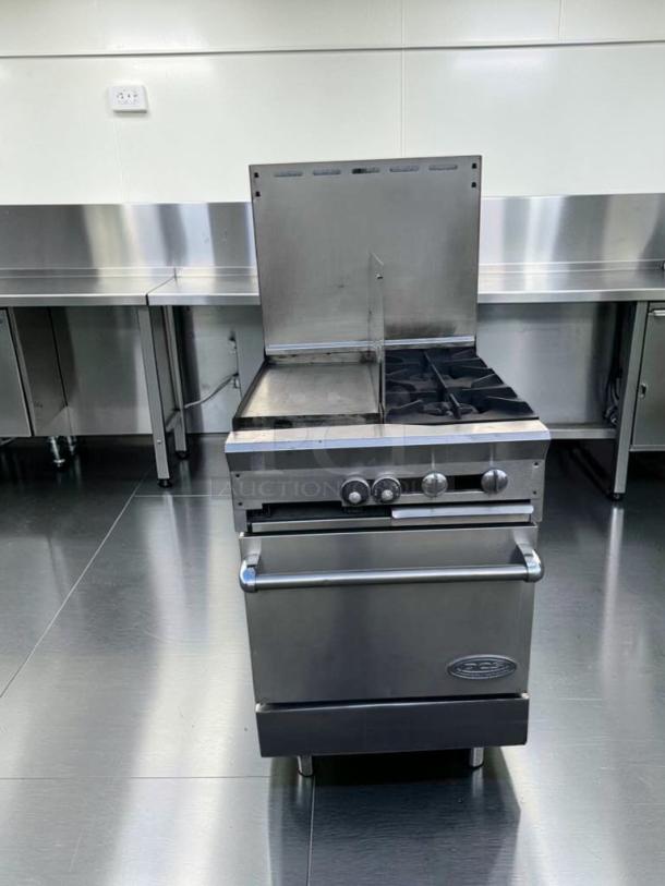 Southbend stainless steel commercial range with griddle and open burners, featuring an oven base; fully tested and operational.
