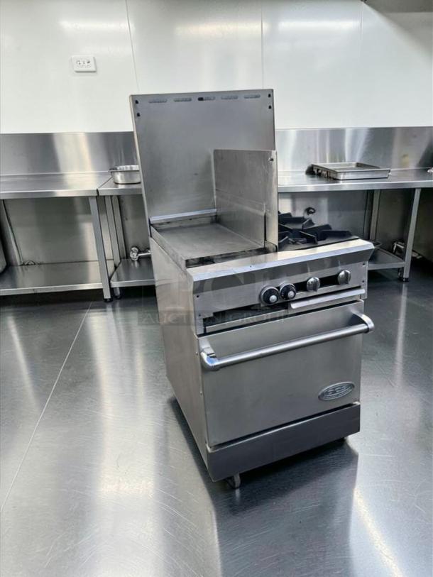 Southbend commercial range with stainless steel exterior, griddle, open burners, and oven base. Fully tested and operational.