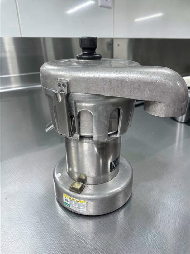 Nutrifaster N450 commercial juicer, heavy-duty stainless steel, excellent condition, fully tested, model label visible.