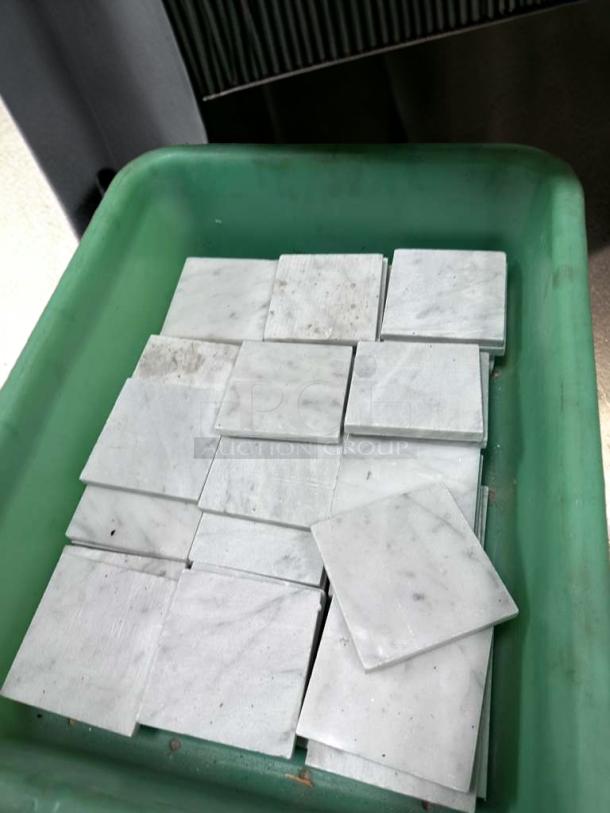 Outstanding condition Carrara White Marble 4x4 honed tiles in a green container, ideal for interior walls and backsplashes.