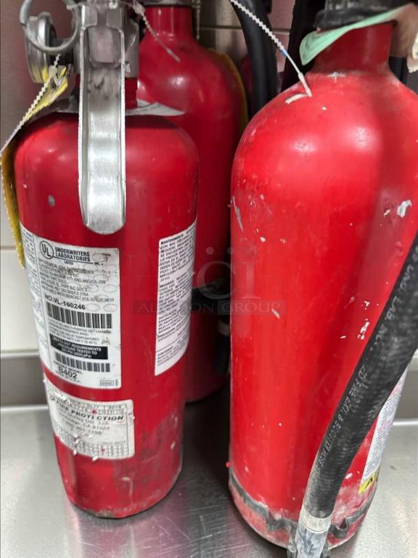 Lot of 9 Commercial 5 lb ABC fire extinguishers; 2A:10B:C rating, UL listed. Slight wear, ideal for kitchens/restaurants.