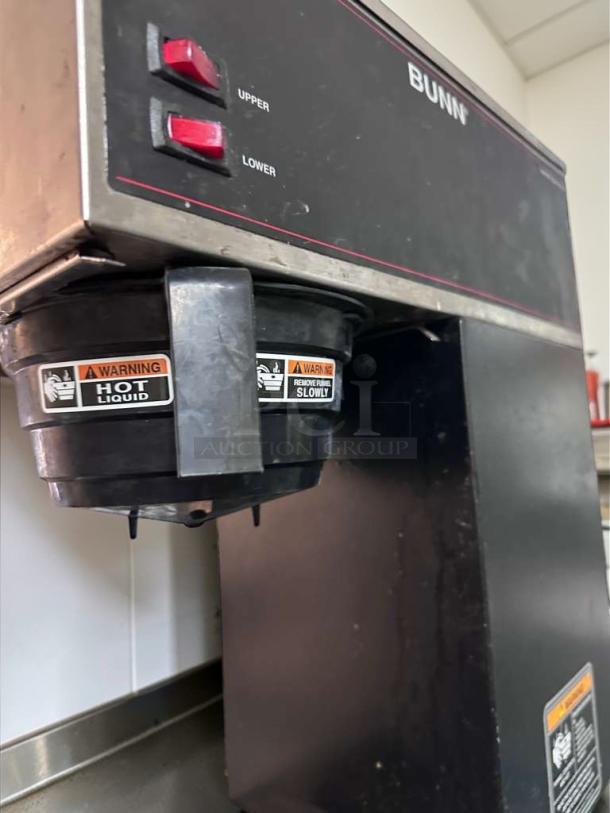 Bunn VPR Coffee Brewer with dual warmer plates, red upper and lower switches, and safety warning labels visible.