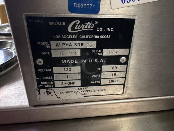 Wilbur Curtis Alpha 3DR-12 commercial coffee brewer label showing model, serial number, voltage, amps, UL listing.