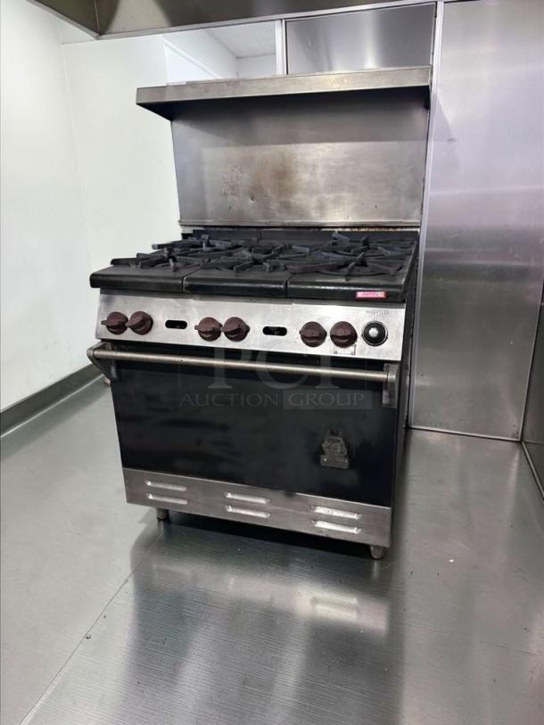 Wolf 36-inch 6 burner gas range with oven, stainless steel, excellent condition, fully operational, heavy-duty restaurant stove.