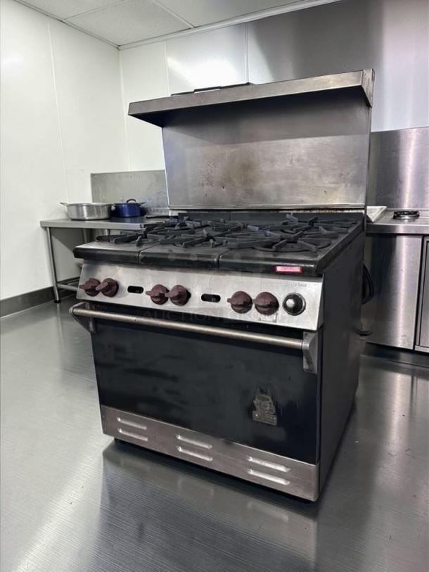 Wolf 36" 6-burner gas range with oven, stainless steel, outstanding condition, USA-made, model WLF-L-RNG-0748, fully operational.