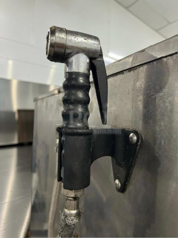 Detailed image of the spray nozzle on a BKI TE102R Combiking Combi Oven, showing operational condition.