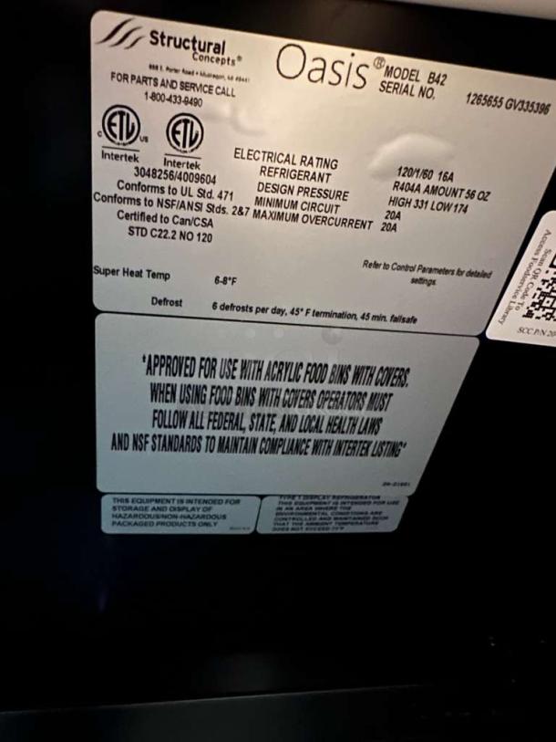 Label of Structural Concepts Oasis B42 refrigerated display case, shows specifications, certifications, and usage instructions.