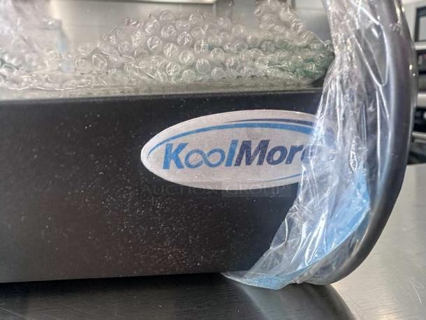 KoolMore DC-3CB display case, flawless condition, 2.7 cu. ft., 3 adjustable shelves, KoolMore logo visible, protective wrapping.
