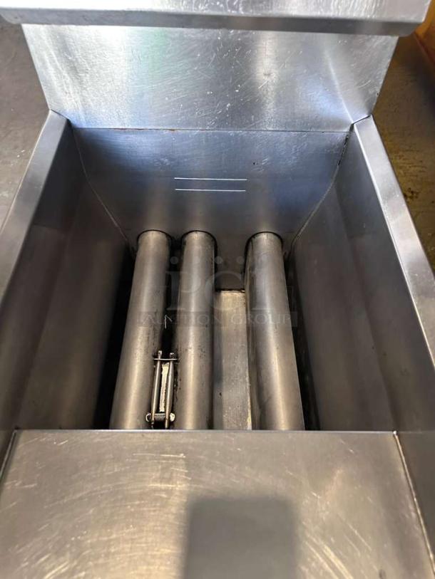 Frymaster stainless steel commercial gas fryer in prime condition. Heavy-duty floor model, fully tested and operational.