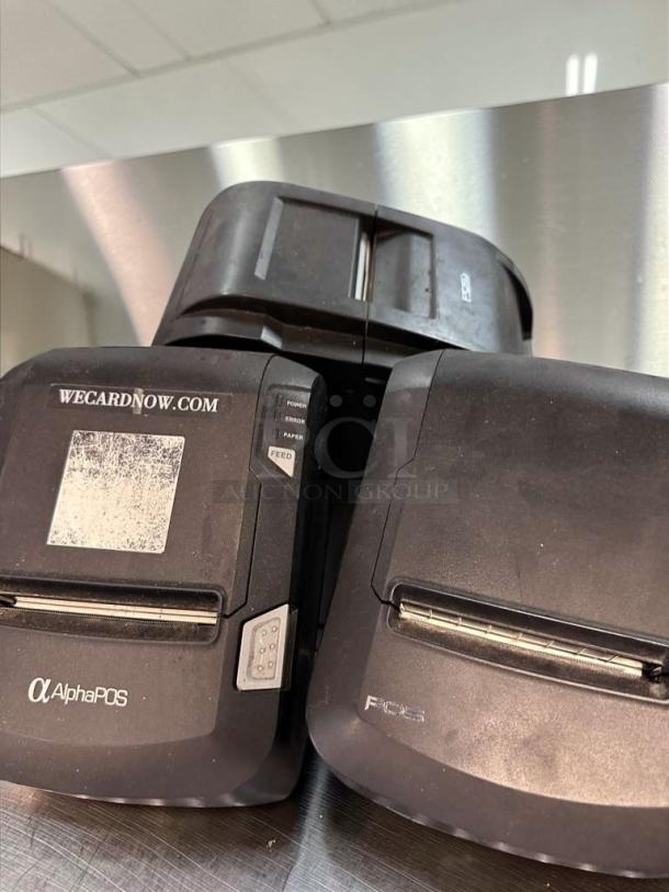 Three AlphaPOS thermal receipt printers, high-grade condition, USB interface, fully tested; visible branding and buttons.