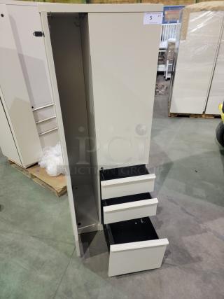 Herman Miller Meridian storage tower with full-height locker, three drawers, coat hooks; powder-coated parchment finish.