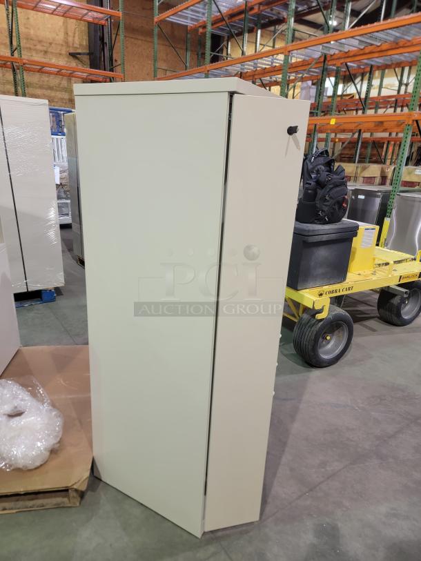 Herman Miller Meridian storage tower, industrial steel, powder-coated parchment. Features wardrobe locker, coat hooks, three drawers.