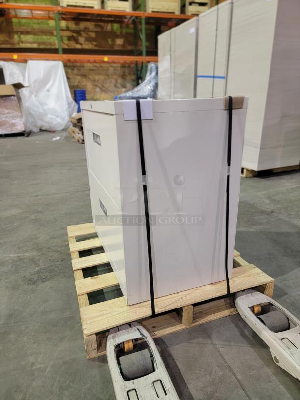 HON 30" lateral file cabinet, two drawers, steel construction, powder-coated finish, central lock with key, on a pallet.