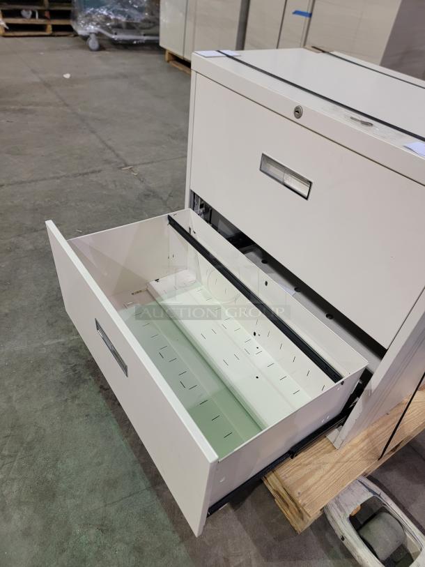 HON 30" lateral file cabinet with two drawers, central lock, sleek design, and durable powder-coated finish.