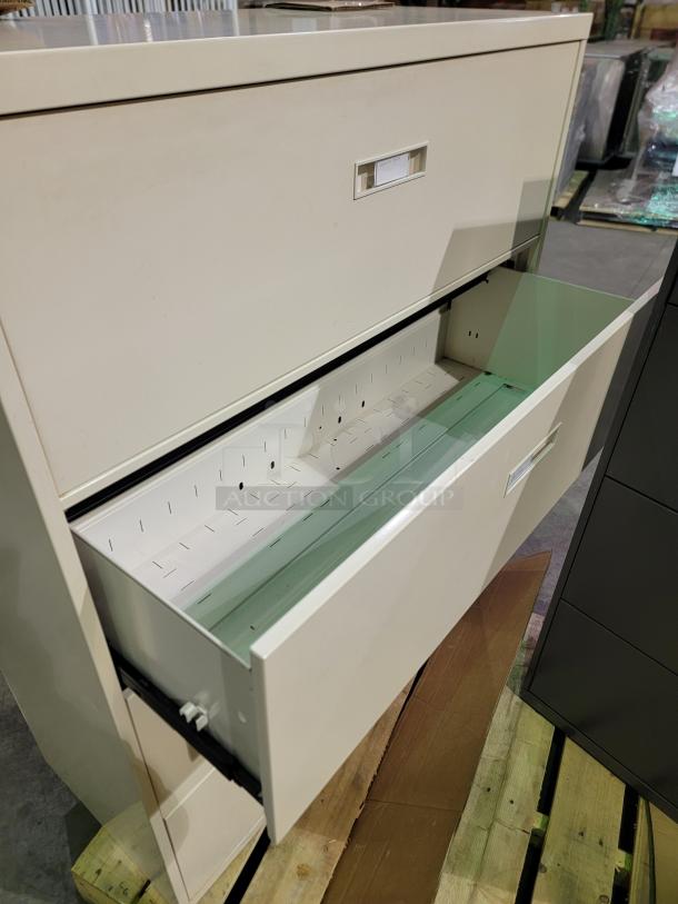 Lot of 2 HON 4-drawer lateral file cabinets with reinforced steel, ball-bearing slides, letter/legal file capacity; keys not included.