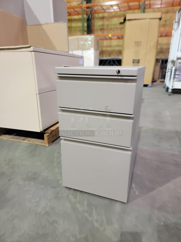 HON 500 Series 3-drawer mobile pedestal in light gray, durable steel with smooth-glide suspensions, keyed for security.