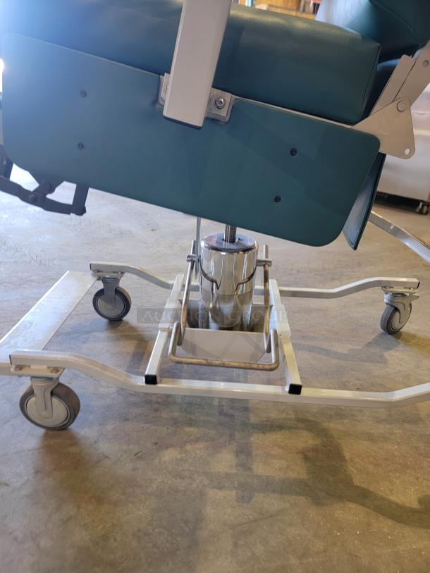 Medtek Custom Comfort hydraulic utility chair with steel frame, hydraulic lift, and pivoting arms. Ideal for versatile use.