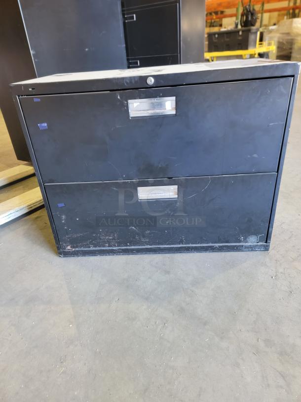 Lot of 3 HON black lateral file cabinets, reinforced steel, various heights, smooth ball-bearing glides, two with keys.