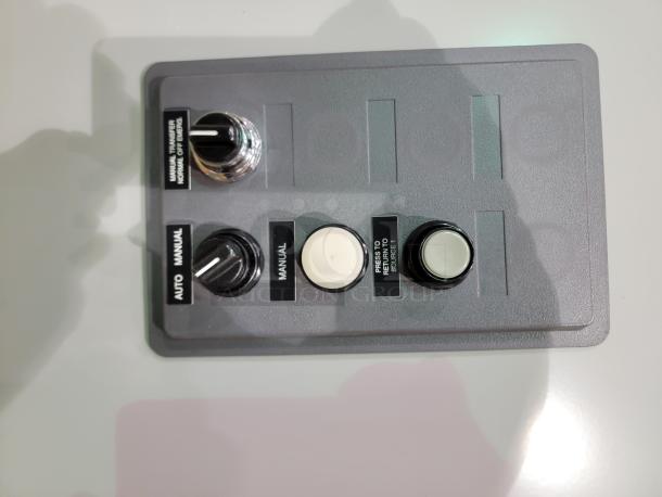 Eaton ATC-300 Transfer Switch panel, featuring auto/manual knobs and source return button. New, robust, wall-mount design.