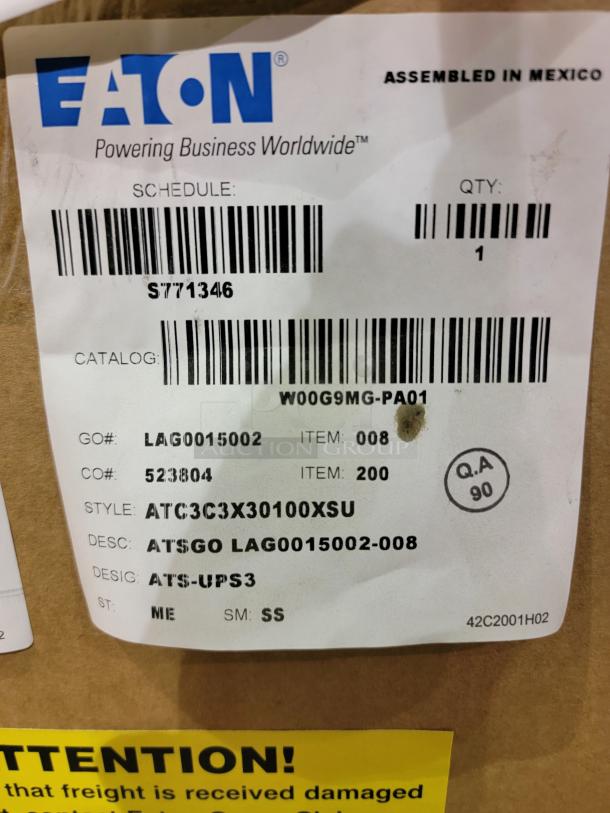 Eaton ATC-300 automatic transfer switch in box, features microprocessor controller, LCD display, LEDs, manual controls.